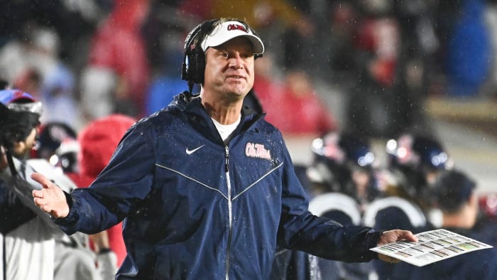 Ole Miss coach Lane Kiffin spreads his arms on the sideline